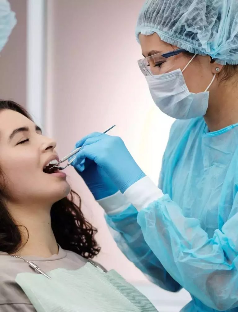 Dental nurse with patient